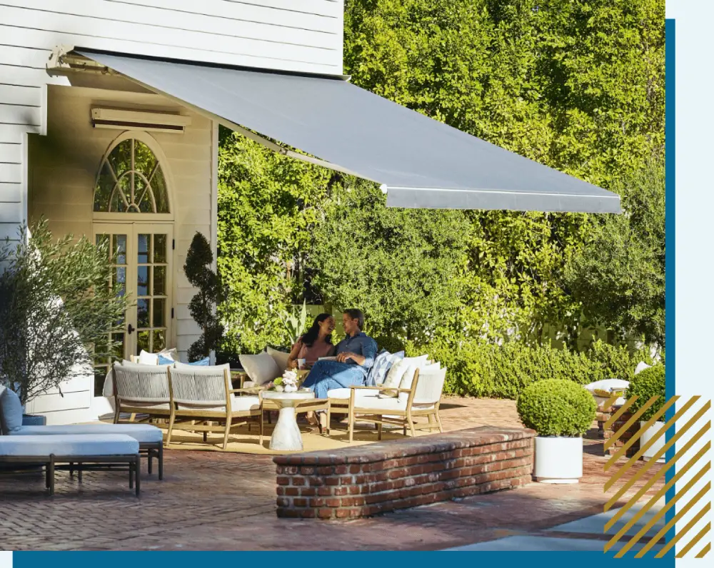 Outdoor patio with seating and awning.